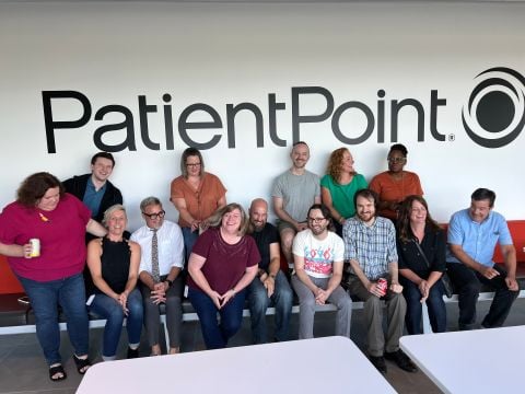 Teammates under the PatientPoint Logo