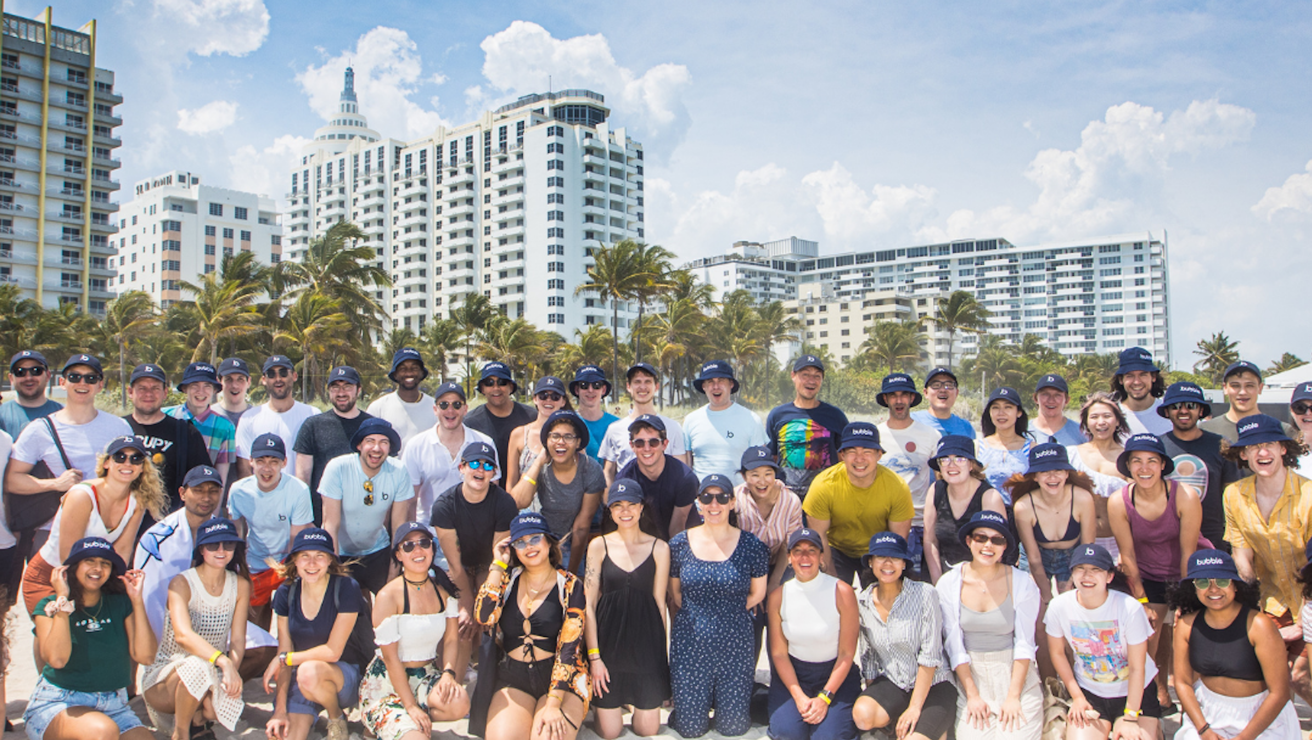 The Bubble team gathers on a beach in Miami.