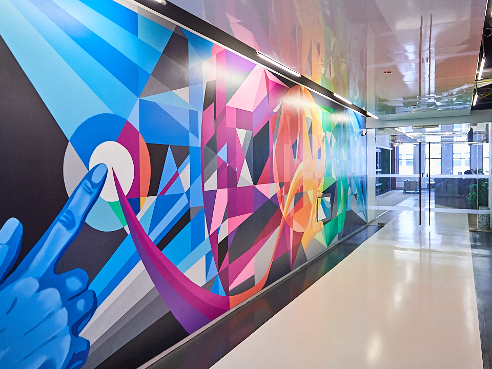office hallway with colorful mural at The Trade Desk