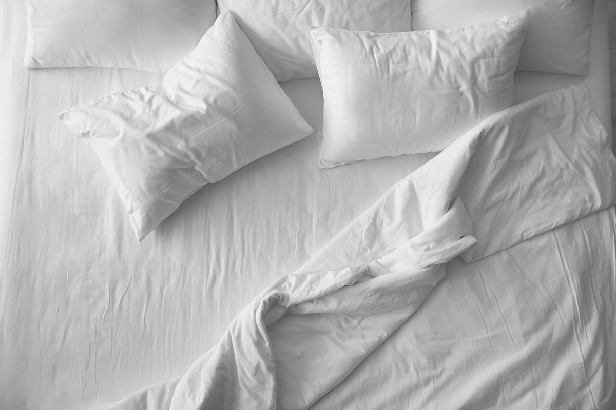 Above view of soft pillows on comfortable bed