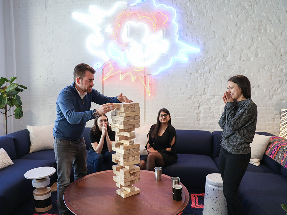 Will Bashford plays jenga with coworkers