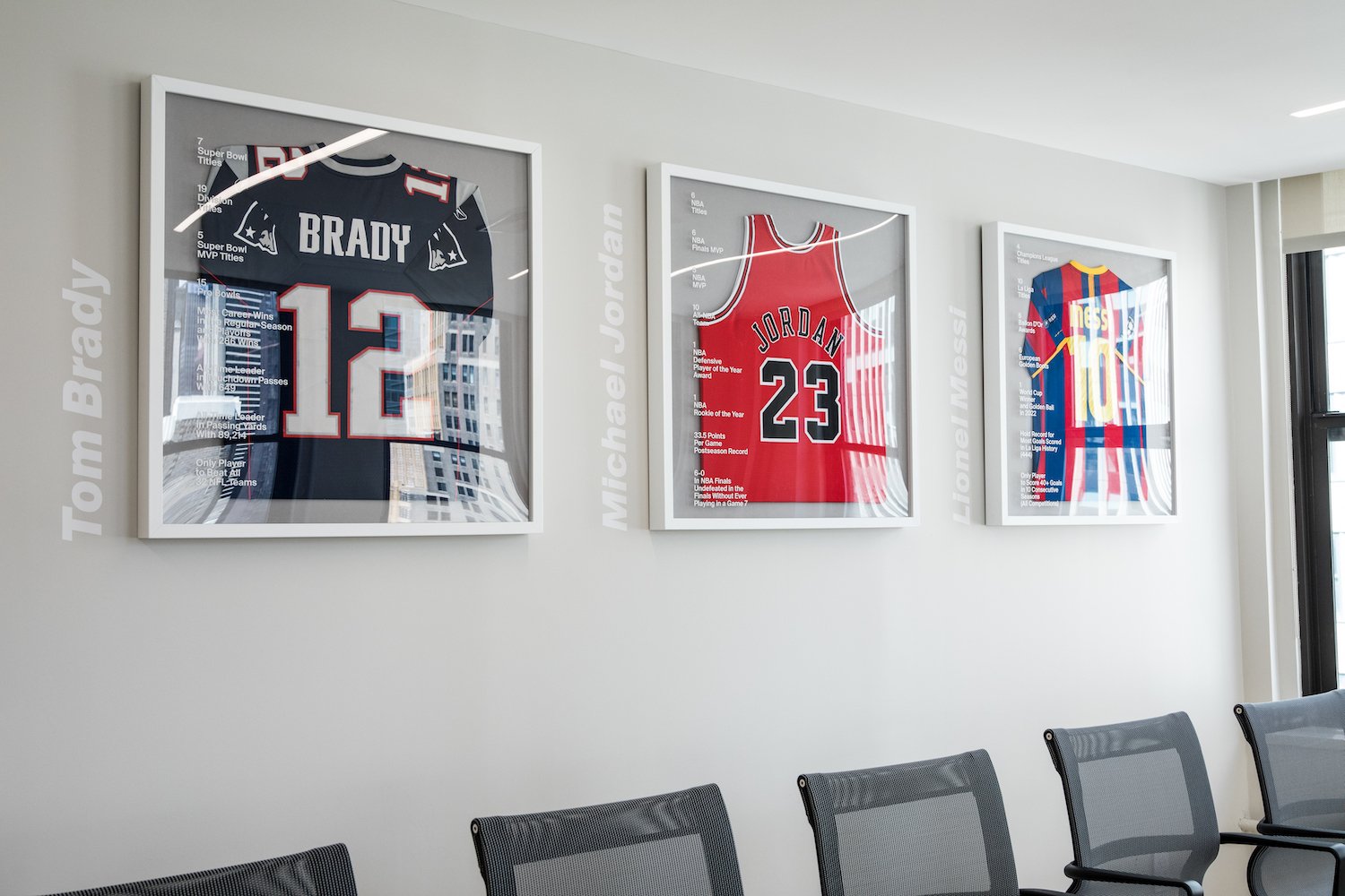 Jerseys hang in a conference room at WSC Sports’ new office.