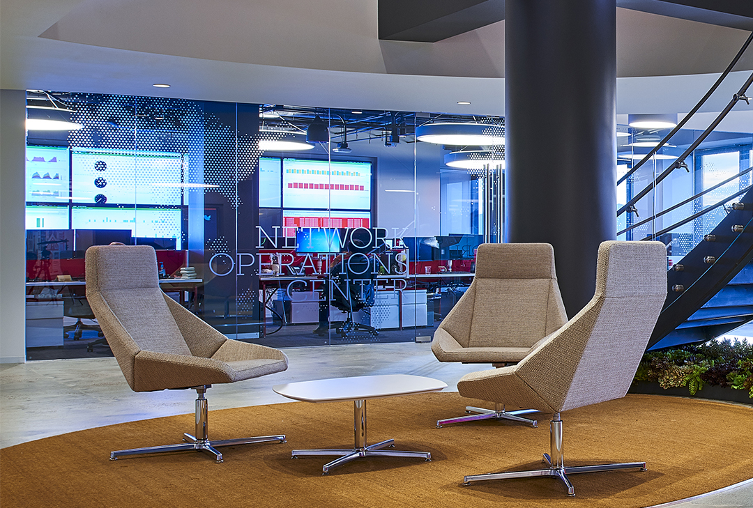 boingo wireless office lounge with three chairs and a table