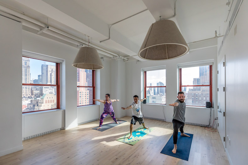 Shutterstock employees doing yoga.