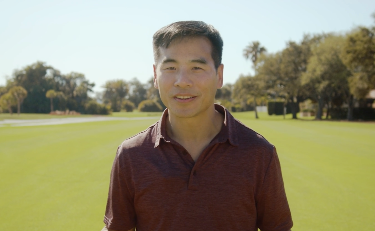 Sparrow Golf CEO Joe Chin is pictured on a golf course.