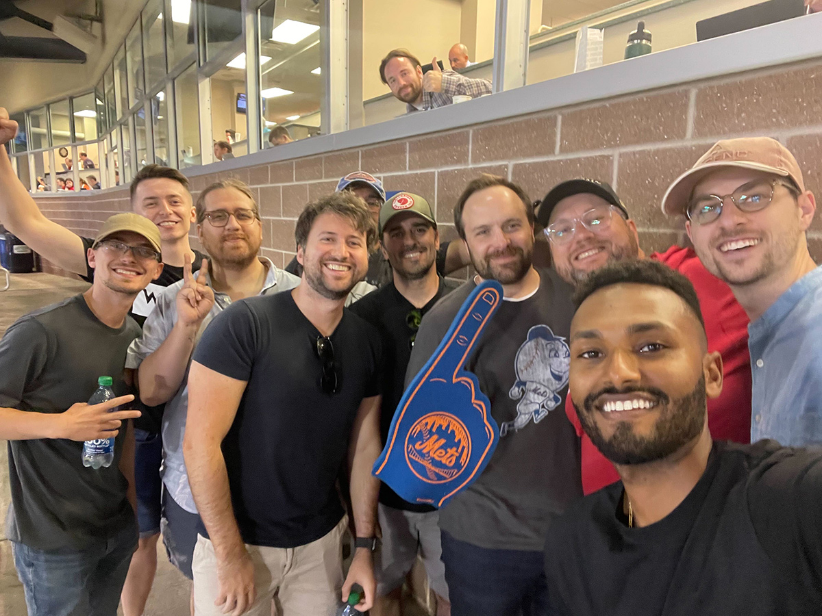 Tropic team members at a Mets game