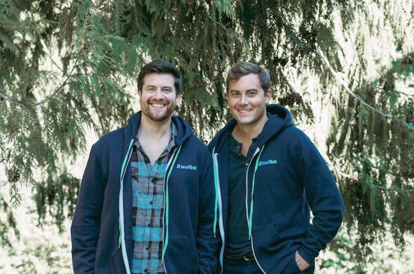 LeafLink co-founders Zach Silverman (left) and Ryan Smith (right) stand in front of trees for a photo.