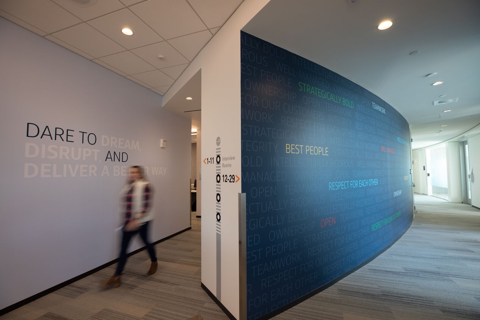 Photo of Capital One offices showing hallways featuring curved wall with motivational words