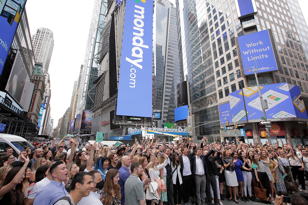 monday.com team members cheering in Times Square