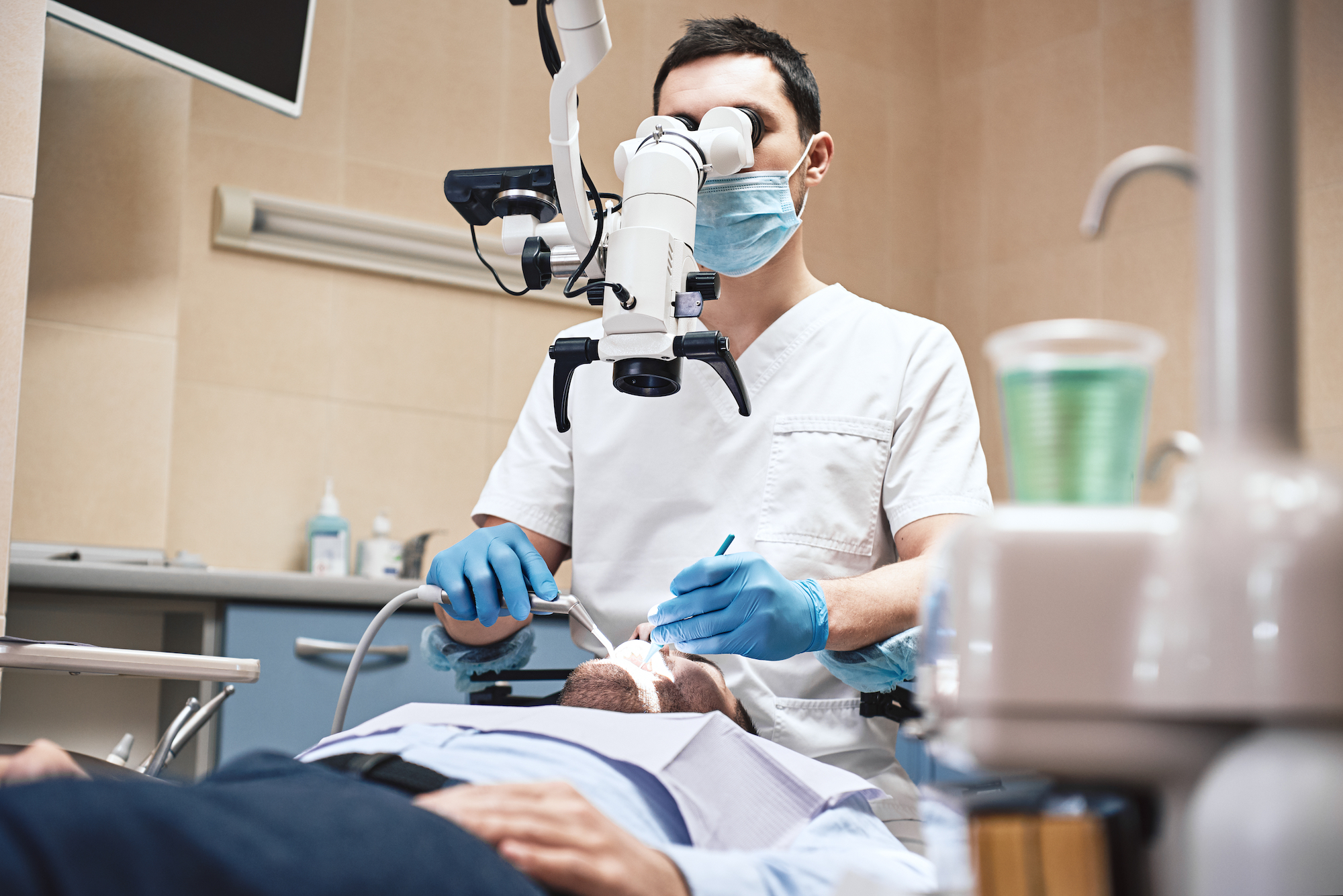A dentist is pictured treating a patient.