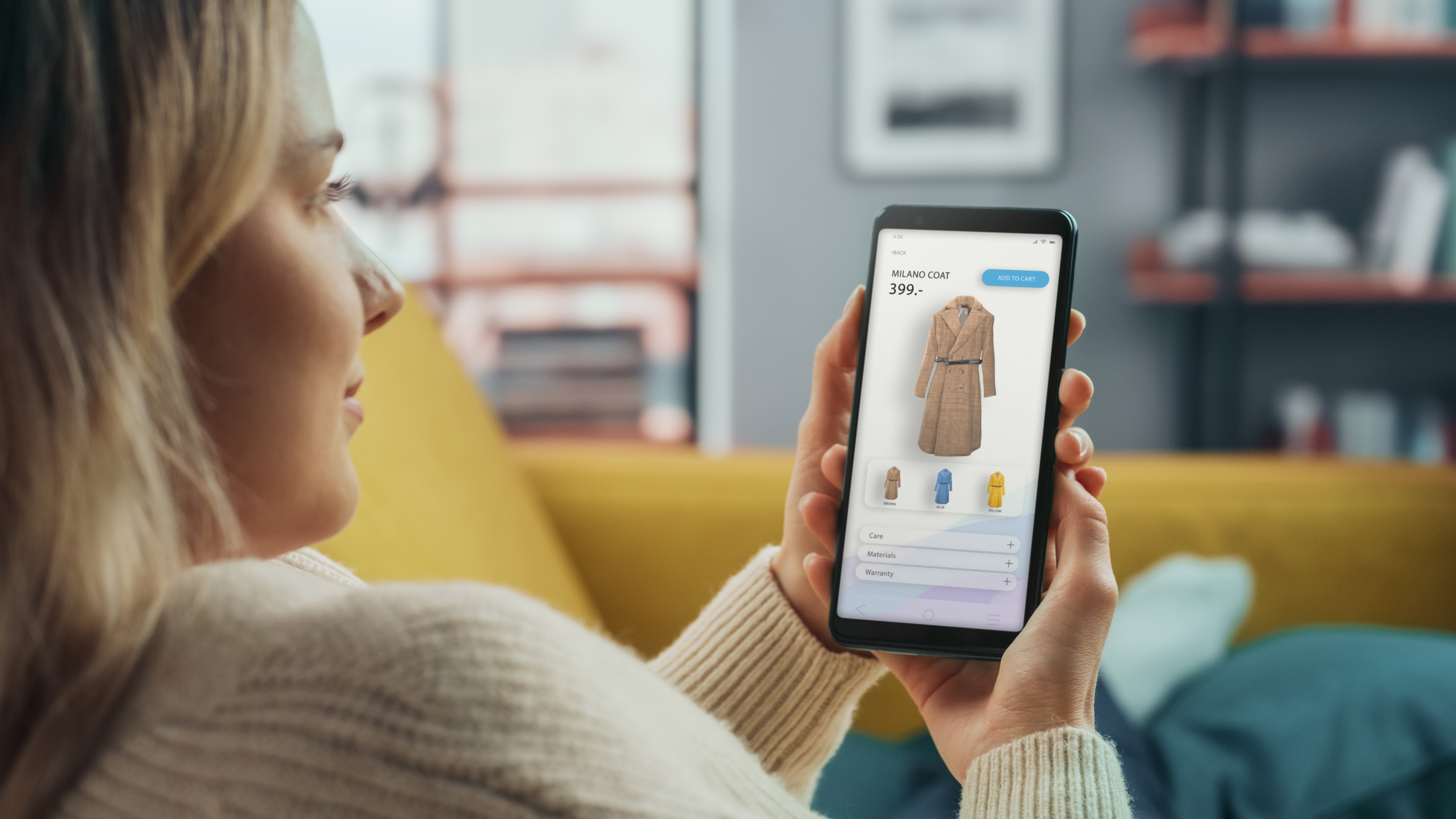 A woman is shopping for clothes on her smartphone