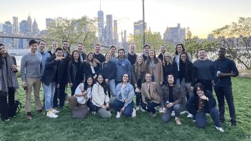 Image of Block Renovation team gathered in front of New York City skyline