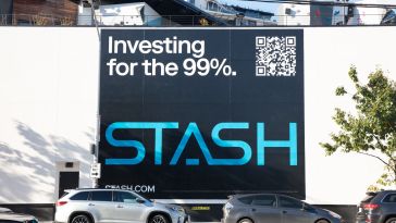 A Stash billboard that says "investing for the 99%"