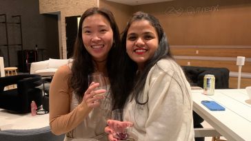 Current team members at a company wine tasting event