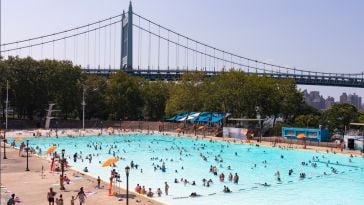Astoria Pool at Astoria Park during the Summer with People and the Triborough Bridge in the Background