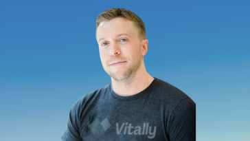 Vitally founder and CEO Jamie Davidson is pictured against a blue background.