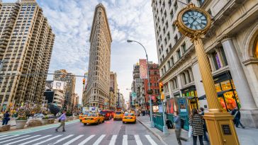 A view of the Flatiron Building from Fifth Avenue in New York City.