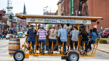 A Pedal Tavern party bike traverses the streets of Nashville.