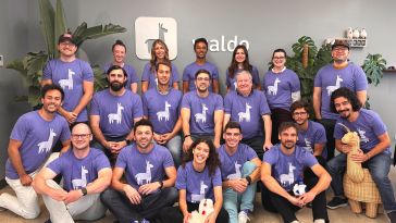 Waldo team photo, all in purple llama shirts.